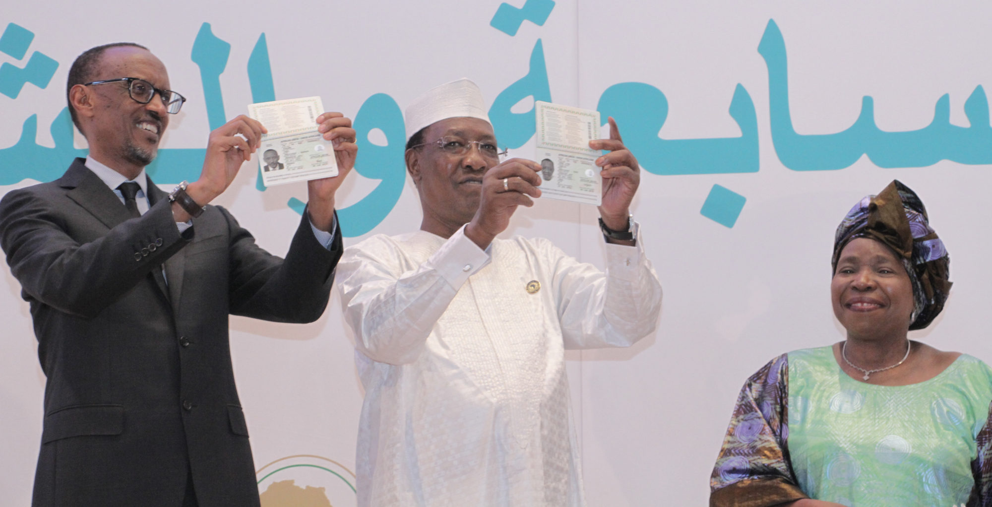Rwandan President Paul Kagame and Chadian President Idriss Déby, flanked by African Union Commission Chairperson Nkosazana Dlamini-Zuma, show off their new pan-African passports at the AU summit in Kigali in July 2016. Photo credit African Union
