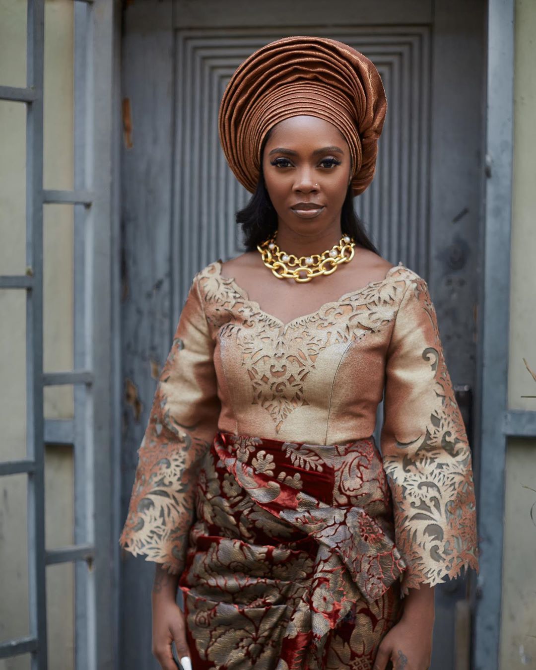 Tiwa Savage looking royal in an outfit by Bridget Awosika