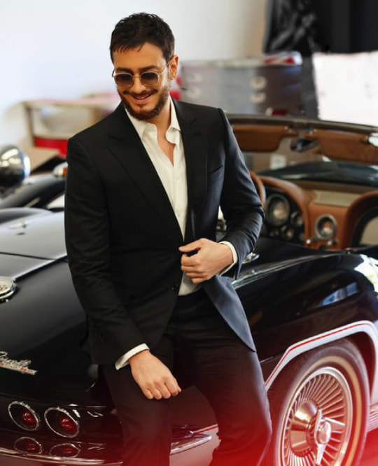 Saad looking sophisticated in a black suit