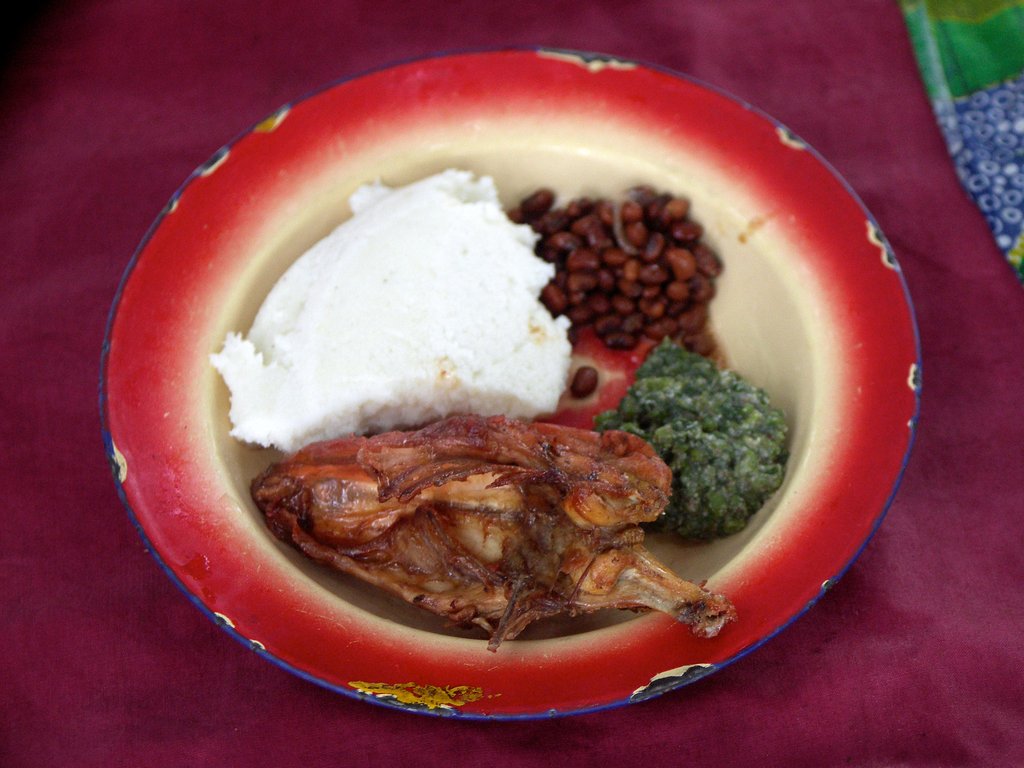 Pap (nshima) with Village Chicken and Pumpkin Leaves