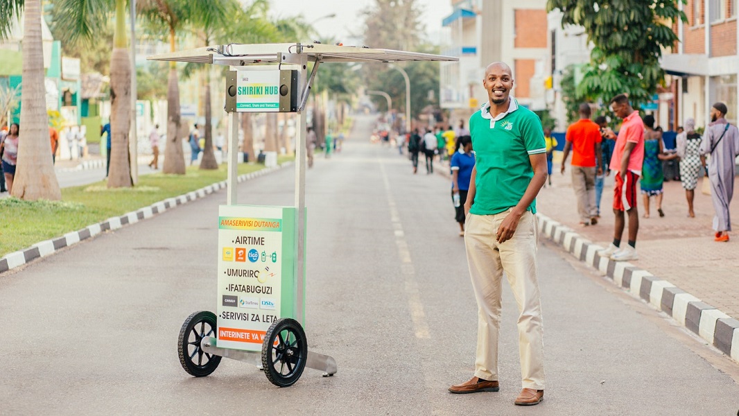 Henri Nyakarundi with his solar-powered kiosk