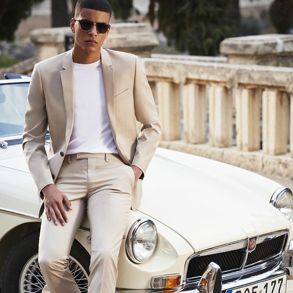 Zakaria Kharie in a beige suit