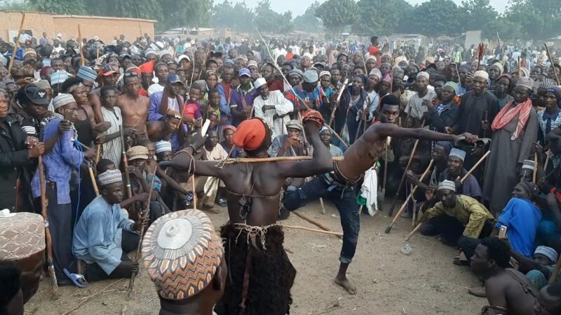 Fulani men performing the Sharo during their bridal traditions