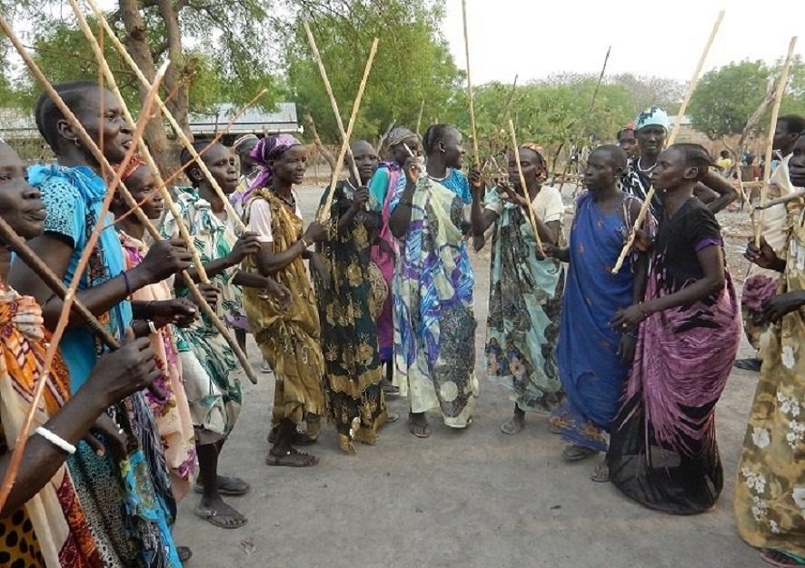 Nuer women shaking a leg during a wedding