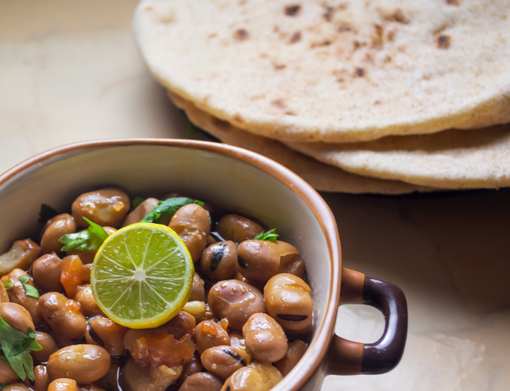 Ful Medames - Dish of Egyptian fava beans with lemon ,cumin ,vegetable