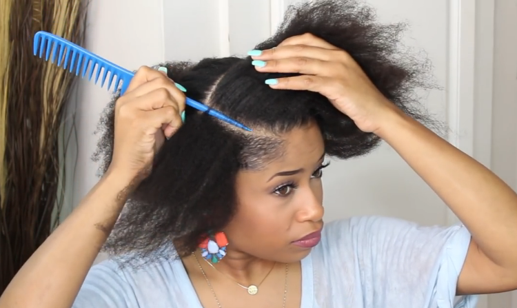 Combing through your hair to remove any tangles or knots (Natural Hair Style Tutorial)